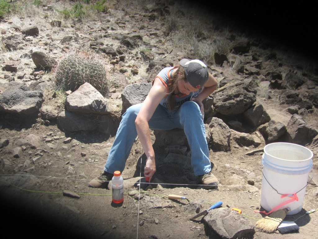 Here I am hard at work on excavating the Southeast Quadrant unit, level 3 of Feature E