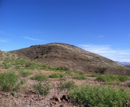 AZ:CC:4:61 (ASM); Round Mountain is a Cerro de Trincheras site and according to radiocarbon dates collected from the 2014 field season the site dates to cal.BC 510 to 395 Round Mountain contains culturally constructed terraces and rock rings. The artifact assemblage includes: groundstone (manos and metates), lithic flakes and projectile points (crafted from obsidian, chert, and rhyolite), and ceramic sherds (the ceramics however are not associated with the main period of occupation).